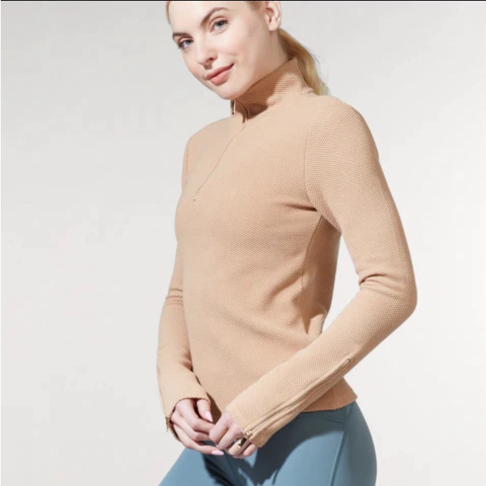 Women’s smart activewear neutral long sleeve top with gold accents